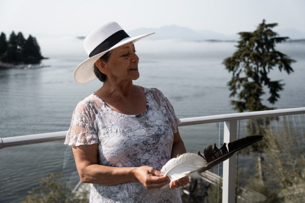 Connie gifting the Edges of Earth team eagle feathers she found. Photo Credit: Adam Moore